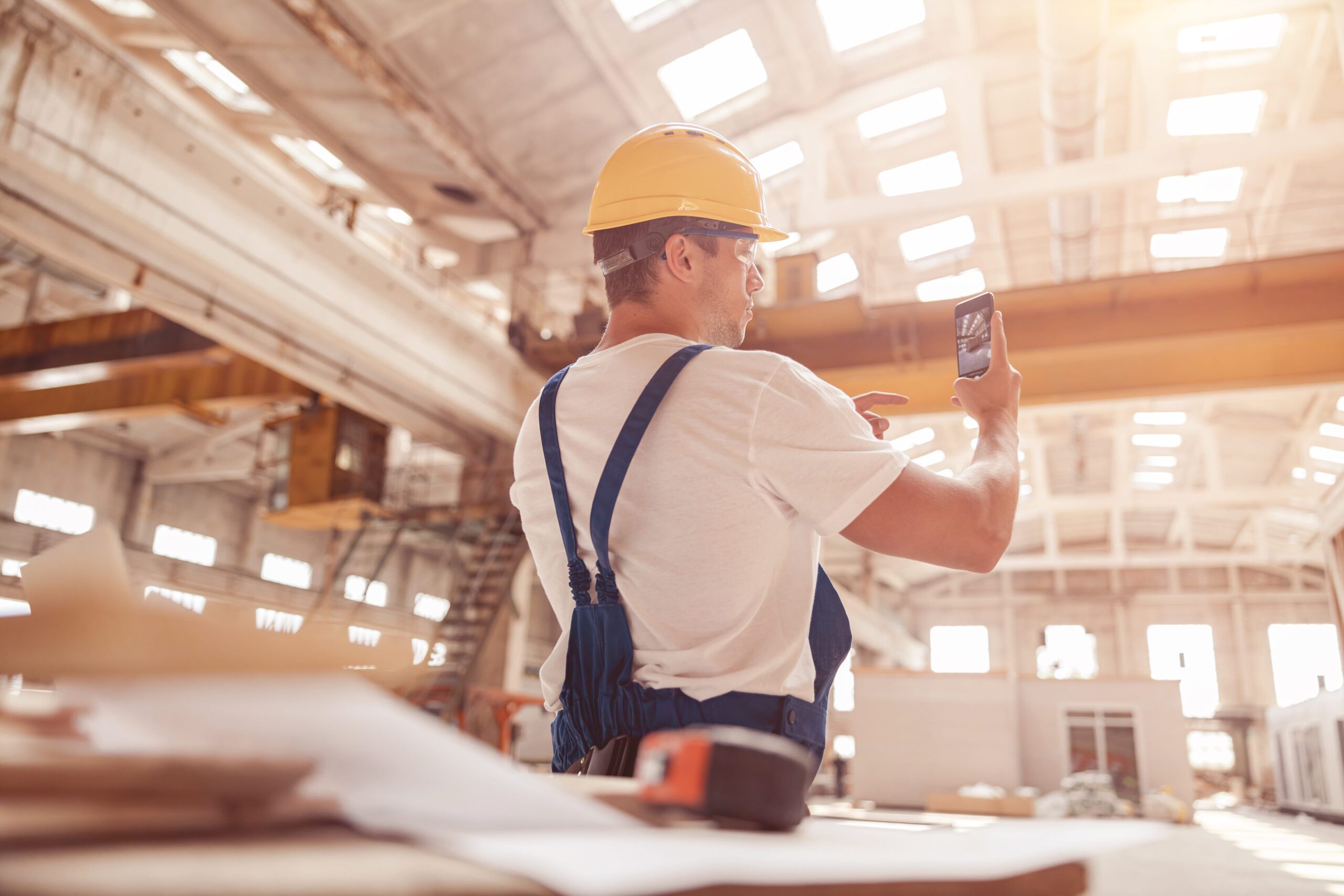 male-worker-taking-building-photo-with-modern-smar-2023-11-27-05-29-43-utc (1)